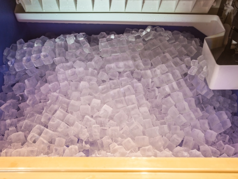 Close-up of a full ice bin, highlighting the potential problem when an ice machine stops working and can't produce more ice