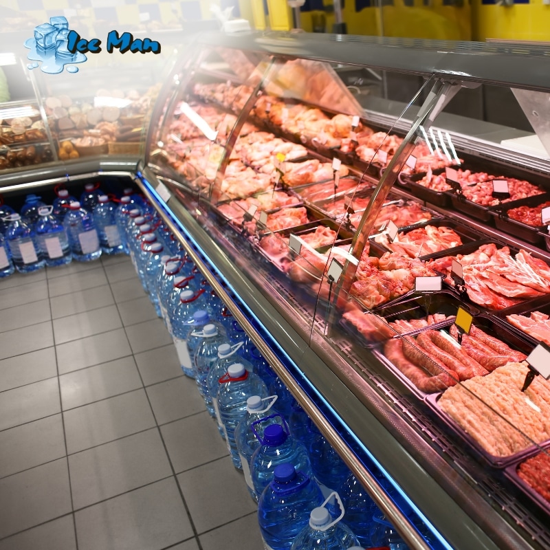 Refrigerator display case with meats and bottled water, illustrating reliable commercial refrigeration services in Allambie Heights